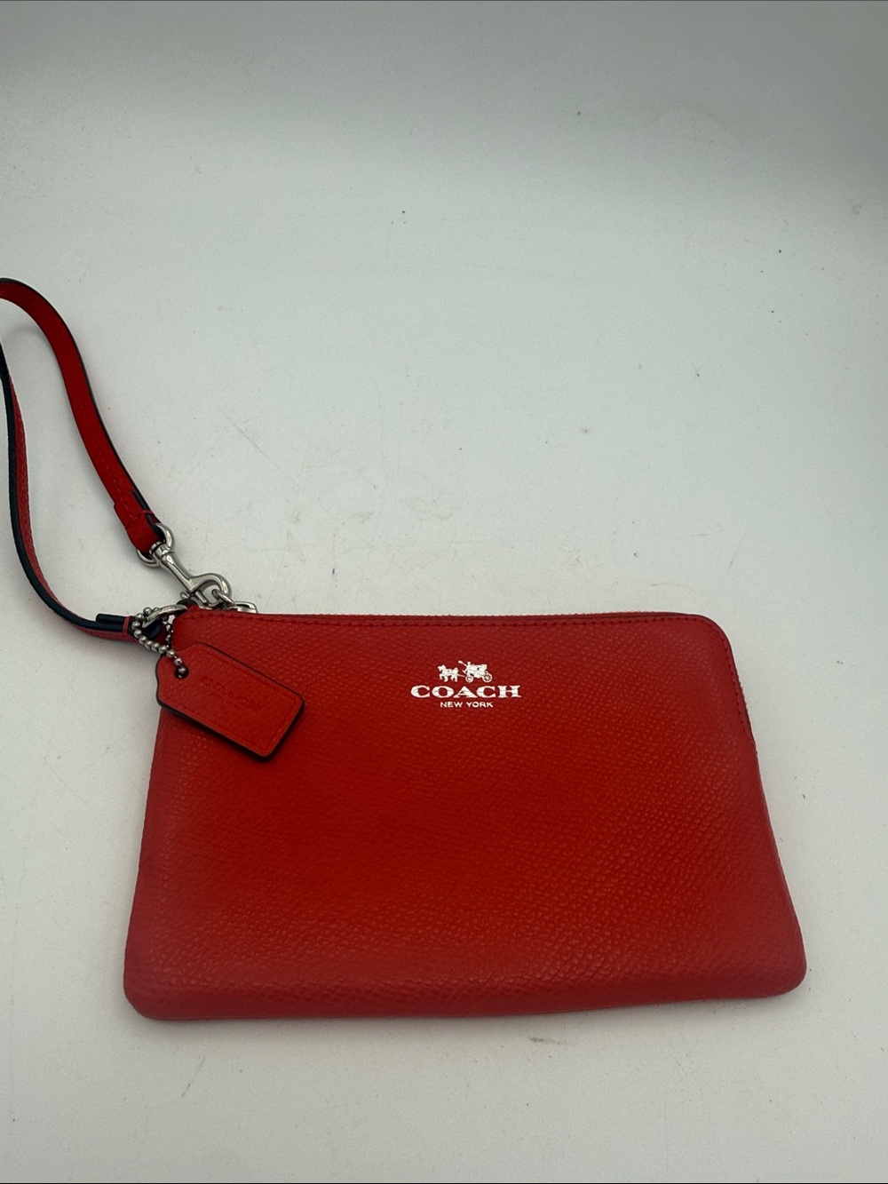 Coach orange crossgrain Leather corner Zip Wristlet wallet